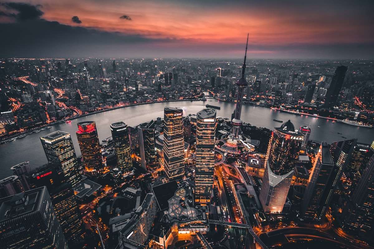 Asian metropolitan skyline at dusk with dense towers and lights